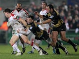 Montpellier's French centre Thomas Combezou tackles Ulster's Irish wing Craig Gilroy during the European Cup rugby union match between Ulster and Montpellier at Ravenhill Stadium in Belfast, Northern Ireland on January 10, 2014