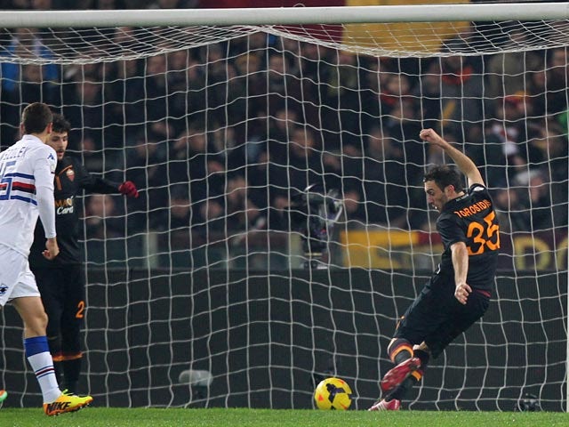 Roma's Vasilis Torosidis scores the opening goal against Sampdoria during their TIM Cup match on January 9, 2014