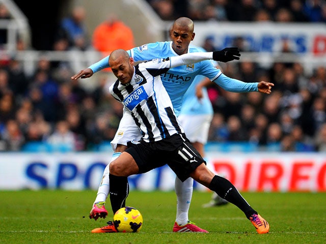 Newcastle's Yoan Gouffran and Manchester City's Fernandinho in action during their Premier League match on January 12, 2014