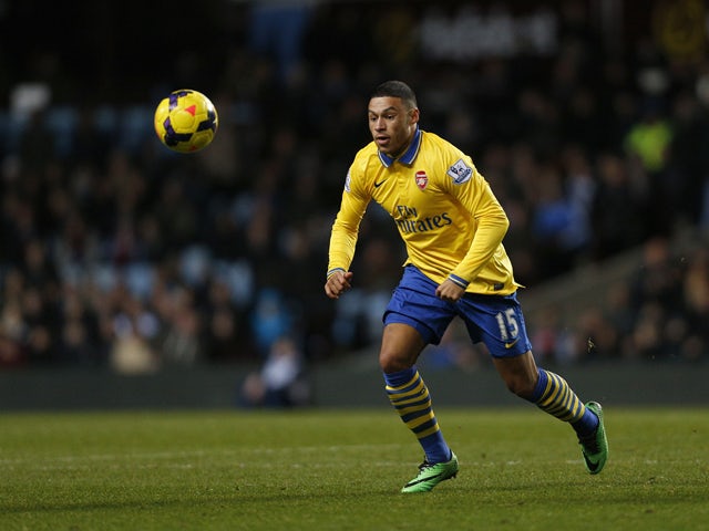 Arsenal's English midfielder Alex Oxlade-Chamberlain in action during an English Premier League football match between Aston Villa and Arsenal at Villa Park in Birmingham on January 13, 2014
