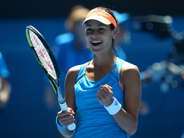 Ana Ivanovic celebrates after her win over Serena Williams in their Australian Open fourth round match on January 19, 2014