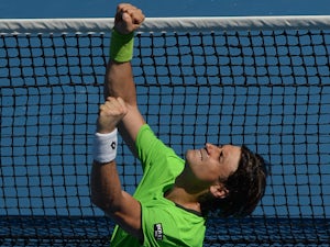 Spain's David Ferrer celebrates after victory in his men's singles match against France's Jeremy Chardy on day five of the 2014 Australian Open tennis tournament in Melbourne on January 17, 2014