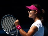 Li Na of China celebrates winning her third round match against Lucie Safarova of the Czech Republic during day five of the 2014 Australian Open at Melbourne Park on January 17, 2014