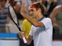 Switzerland's Roger Federer acknowledges fans after his victory against Slovenia's Blaz Kavcic during their men's singles match on day four of the 2014 Australian Open tennis tournament in Melbourne on January 16, 2014