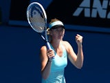 Russia's Maria Sharapova celebrates winning match point against Italy's Karin Knapp in their women's singles second round match on day four of the 2014 Australian Open tennis tournament in Melbourne on January 16, 2014