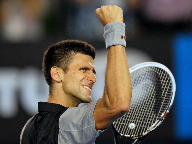 Serbia's Novak Djokovic celebrates after victory in his men's singles match against Uzbekistan's Denis Istomin on day five of the 2014 Australian Open tennis tournament in Melbourne on January 17, 2014