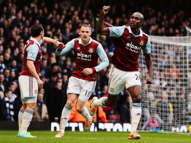 Carlton Cole of West Ham United and team mates celebrate as Newcastle United concede an own goal by Mike Williamson during the Barclays Premier League match on January 18, 2014