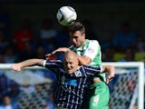 Nicky Bailey of Millwall contests the ball with Dan Seaborne of Yeovil during the Sky Bet Championship match between Millwall and Yeovil Town at The Den on August 03, 2013