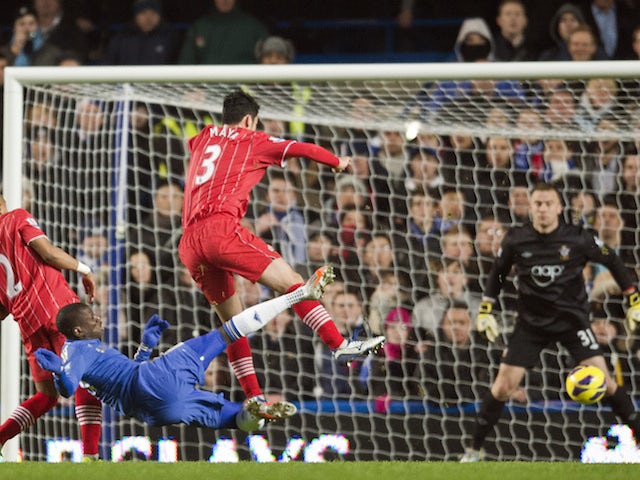 Chelsea's French-born Senegalese striker Demba Ba (2nd L) shoots and scores the opening goal of the English Premier League football match between Chelsea and Southampton on January 16, 2013