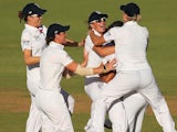 Sarah Taylor and Jennifer Gunn of England celebrate with team mates after the stumping of Jodie Fields of Australia during day three of the Women's Ashes Test on January 12, 2014