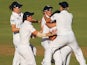 Sarah Taylor and Jennifer Gunn of England celebrate with team mates after the stumping of Jodie Fields of Australia during day three of the Women's Ashes Test on January 12, 2014