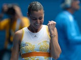 Flavia Pennetta celebrates after her win over Angelique Kerber in their Australian Open fourth round match on January 19, 2014