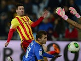 Barcelona's Argentinian forward Lionel Messi shoots to score in front of Getafe's defender Rafael Lopez during the Spanish Copa del Rey (King's Cup) round of 16 second-leg football match Getafe CF vs FC Barcelona at the Coliseum Alfonso Perez stadium in G