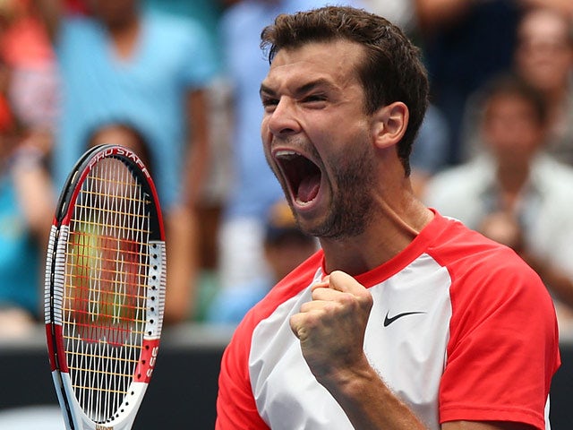 Grigor Dimitrov celebrates after his win over Milos Raonic during their Australian Open third round match on January 18, 2014