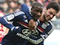 Lyon's Gueida Fofana celebrates with teammate Clement Grenie after scoring his team's second goal against Reims during their Ligue 1 match on January 19, 2014