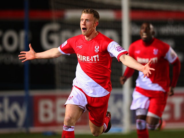 Kidderminster's Jack Byrne celebrates after scoring his team's second goal against Peterborough during their FA Cup third round replay match on January 14, 2014