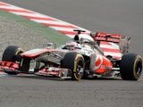 Jensen Button of McLaren drives during a practise session for the Indian Formula One Grand Prix on October 26, 2013