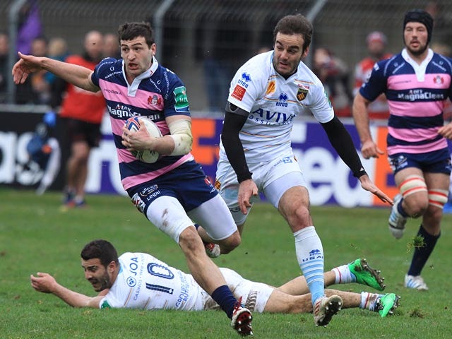 Gloucester's Jonny May runs ahead to score a try against Perpignan during their Heineken Cup match on January 19, 2014