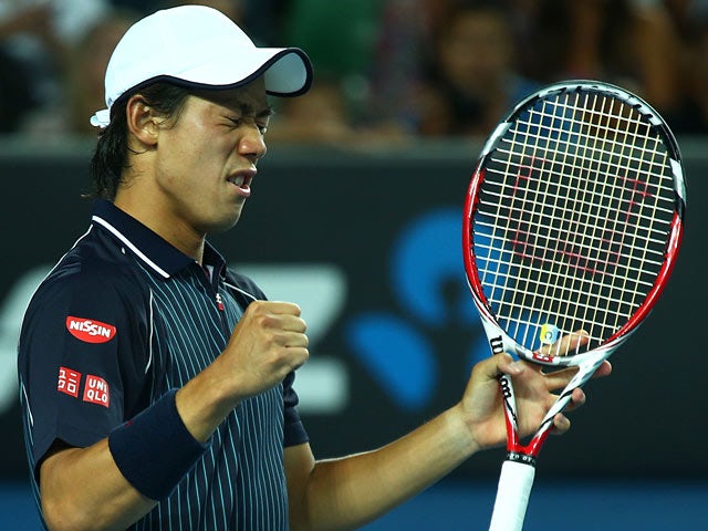 Kei Nishikori celebrates victory over Donald Young during their Australian Open third round match on January 18, 2014
