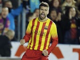Barcelona's defender Gerard Pique celebrates after scoring during the Spanish league football match Levante UD vs FC Barcelona at the Ciutat de Valencia Stadium in Valencia on January 19, 2014