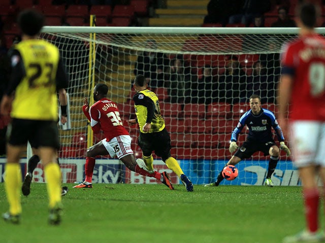 Watford's Lewis McGugan scores his team's second goal against Bristol City during their FA Cup third round replay match on January 14, 2014