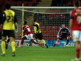 Watford's Lewis McGugan scores his team's second goal against Bristol City during their FA Cup third round replay match on January 14, 2014