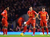 Luis Suarez of Liverpool looks dejected with Daniel Sturridge and Steven Gerrard after the opening goal scored by Andreas Weimann of Aston Villa on January 18, 2014