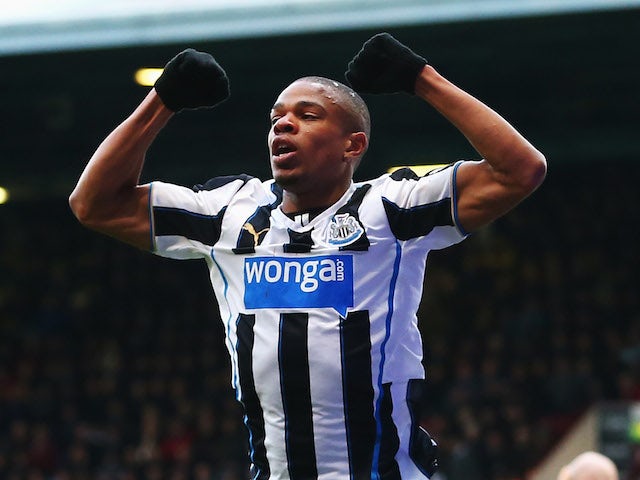 Loic Remy of Newcastle United celebrates scoring his teams second goal during the Barclays Premier League match against West Ham United on January 18, 2014