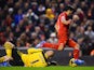 Luis Suarez of Liverpool goes to ground after a challenge by Brad Guzan of Aston Villa leading to a penalty during the Barclays Premier League match on January 18, 2014