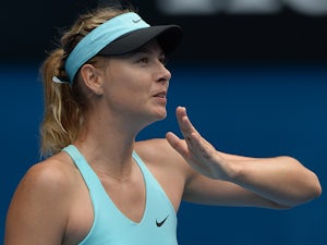 Sharapova battles into round three