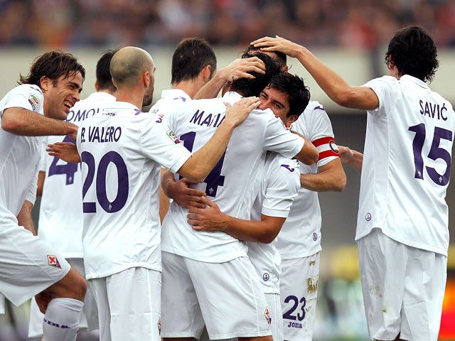 Fiorentina's Matias Fernandez is congratulated by teammates after scoring the opening goal against Calcio Catania during their Serie A match on January 19, 2014