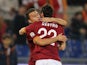 Roma's Mattia Destro celebrates with teammate Adem Ljaijc after scoring the opening goal against Livorno Calcio during their Serie A match on January 18, 2014