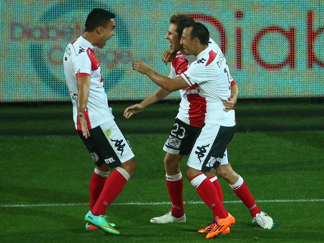 Mate Dugandzic of the Heart celebrates his second goal with team mates during the round 15 A-League match between Melbourne Heart and the Newcastle Jets at AAMI Park on January 17, 2014