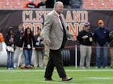 Cleveland Browns president Mike Holmgren greets people on the field prior to to the game between the Cleveland Browns and the Tennessee Titans at Cleveland Browns Stadium on October 2, 2011