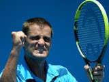 Russia's Mikhail Youzhny gestures as he celebrates victory in his men's singles match against Germany's Jan-Lennard Struff on day one of the 2014 Australian Open on January 13, 2014