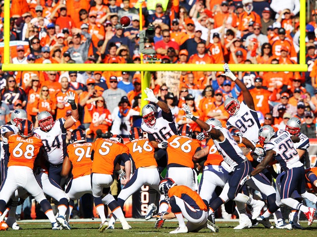 Matt Prater #5 of the Denver Broncos kicks a first quarter field goal against the New England Patriots during the AFC Championship game at Sports Authority Field at Mile High on January 19, 2014