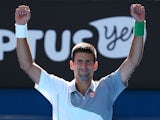 Novak Djokovic celebrates after his win over Fabio Fognini in their Australian Open fourth round match on January 19, 2014