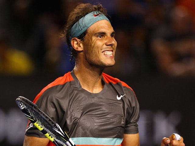 Rafael Nadal celebrates his victory over Gael Monfils in their Australian Open third round match on January 18, 2014
