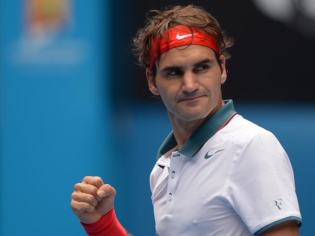 Roger Federer celebrates his win over Teymuraz Gabashvili during their Australian Open third round match on January 18, 2014