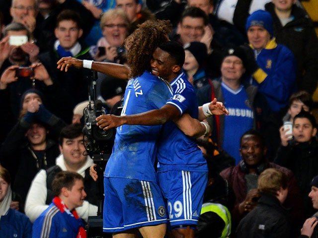 Chelsea's Samuel Eto'o celebrates with teammate David Luiz after scoring his team's second goal against Man United during their Premier League match on January 19, 2014