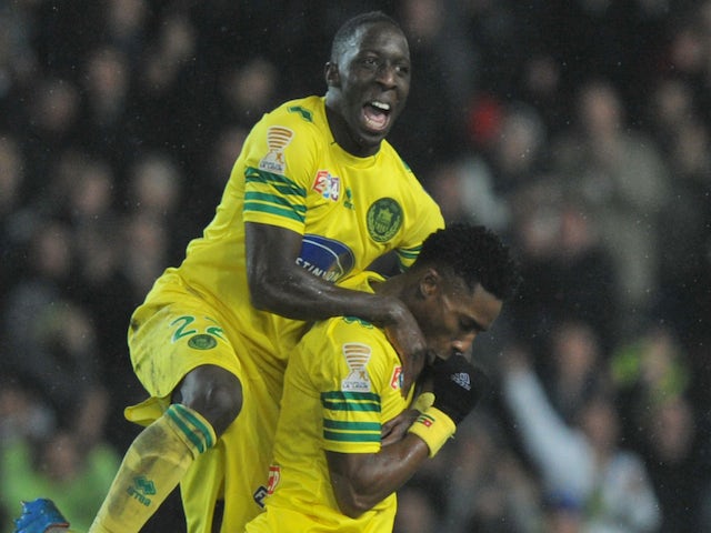 Nantes' Togolese forward Serge Gakpe celebrates with his teammate Nantes' French defender Issa Cissokho after scoring during the French League Cup quarterfinal football match against Nice on January 15, 2014