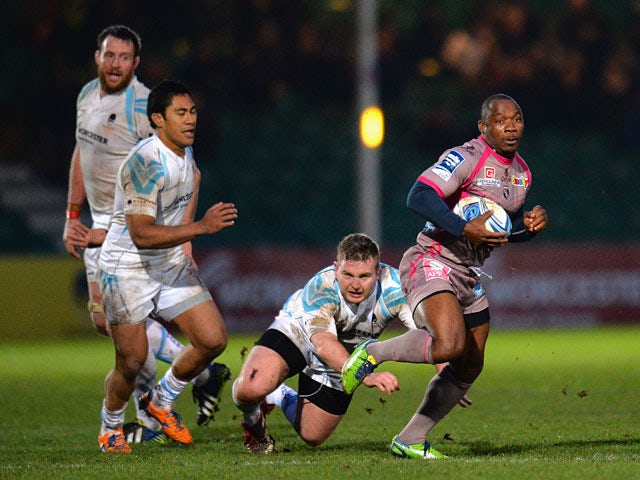 Oyonnax's Silvere Tian breaks through the Worcester Warriors defence during their Challenge Cup match on January 18, 2014
