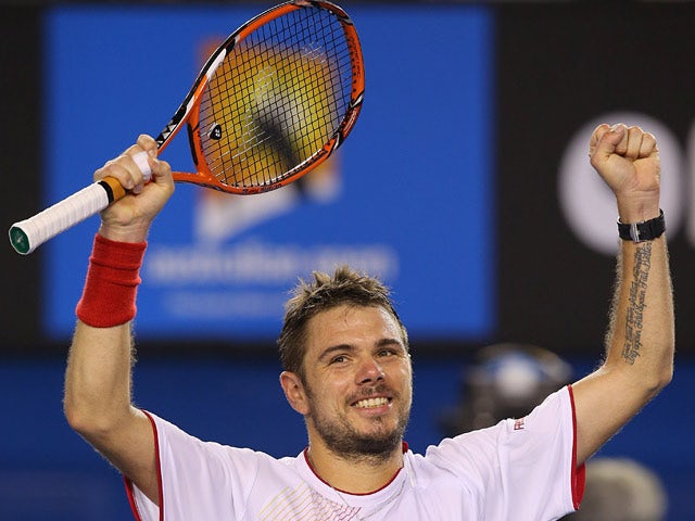 Stanislas Wawrinka celebrates after his win over Tommy Robredo in their Australian Open fourth round match on January 19, 2014