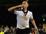 Fulham's Steve Sidwell celebrates after scoring his team's third goal against Norwich during their FA Cup third round replay match on January 14, 2014