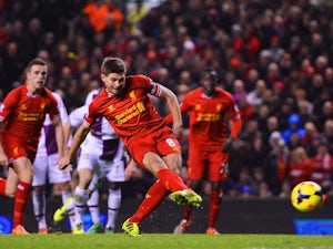 Steven Gerrard of Liverpool scores his penalty during the Barclays Premier League match between Liverpool and Aston Villa at Anfield on January 18, 2014