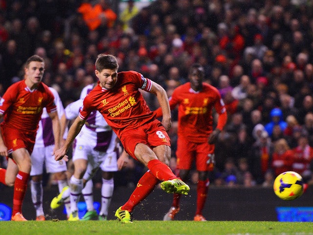 Steven Gerrard of Liverpool scores his penalty during the Barclays Premier League match between Liverpool and Aston Villa at Anfield on January 18, 2014
