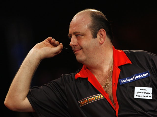 Ted 'The Count' Hankey of England prepares to throw a dart against Tony 'The Silverback' O'shea of England during The Lakeside World Darts Championships Final match at Lakeside in Frimley Green on January 11, 2009