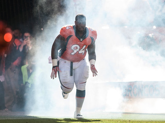 Terrance Knighton #94 of the Denver Broncos runs onto the field before a game against the Washington Redskins on October 27, 2013