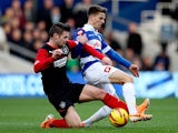 QPR's Tom Carroll and Huddersfield's Oliver Norwood in action during their Championship match on January 18, 2014