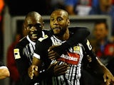 Yoann Arquin of Notts County is congratulated on his goal during the Capital One Cup Second Round between Liverpool and Notts County at Anfield on August 27, 2013